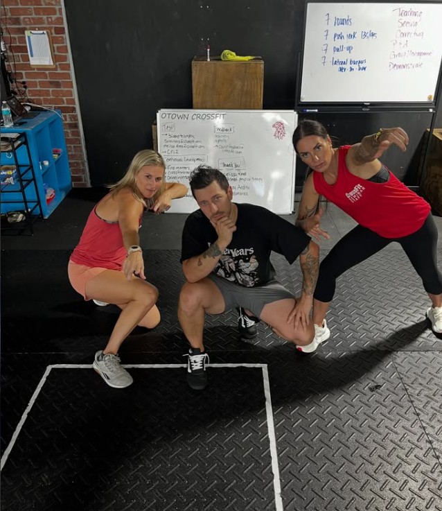 Brian Yepez coaching two clients at OTOWN CrossFit
